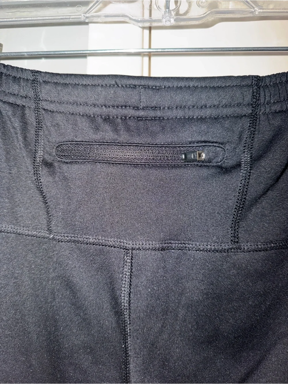 Nike Black Track Pants with White Swoosh and Reflective Details